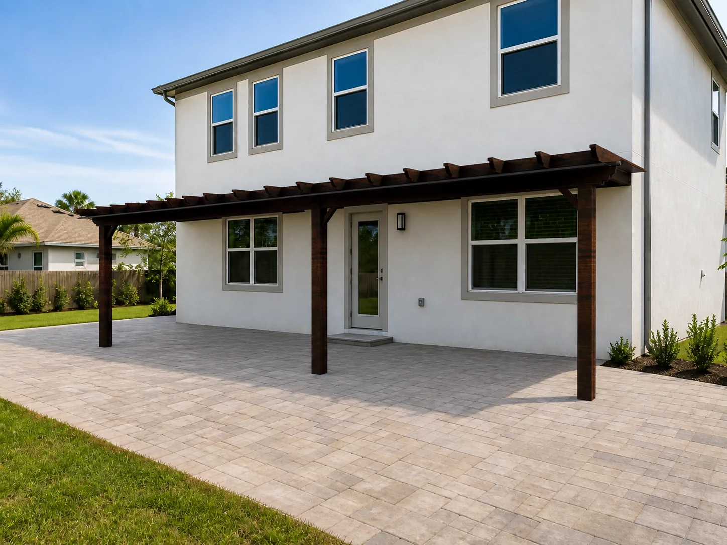 Dark timber wall-mounted pergola with four posts visualized across a paved house terrace